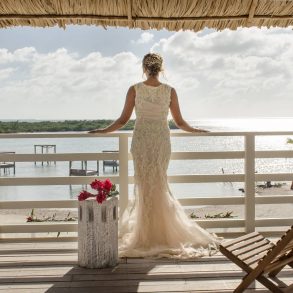 Bride overlooking ocean at Mahogany Bay Resort